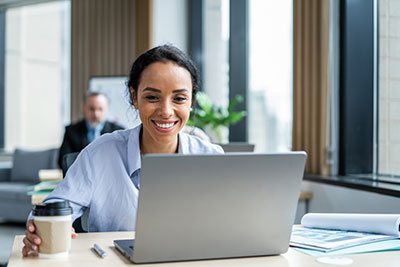 Woman using her laptop to get a quote for no medical exam life insurance